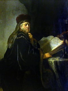 A Scholar Seated at a Table with Books